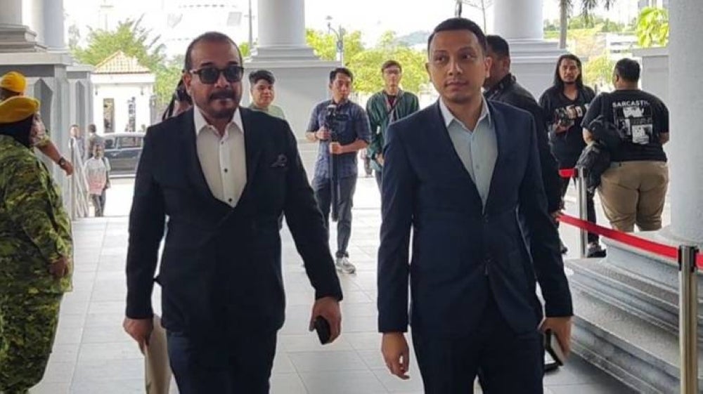 Khalid (left) at High Court this morning