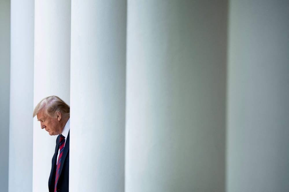 Donald Trump arrives to announce a new immigration proposal, in the Rose Garden of the White House in Washington, DC on May 16, 2019. Donald Trump said he will turn himself in on August 24, 2023 in Georgia to face racketeering and other charges stemming from his bid to overturn the 2020 election. - Photo by AFP