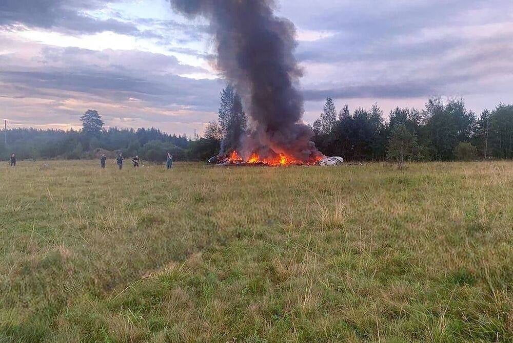 This photograph posted on a Wagner linked Telegram channel @grey_zone on Aug 23, 2023, shows a burning plane wreckage near the village of Kuzhenkino, Tver region. (Photo by Handout / TELEGRAM/ @grey_zone / AFP)