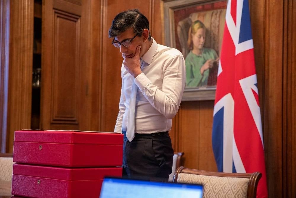 UK Prime Minister Rishi Sunak should have declared his wife's stake in a company that was set to benefit from government cash, a parliamentary watchdog declared on Thursday. - Facebook