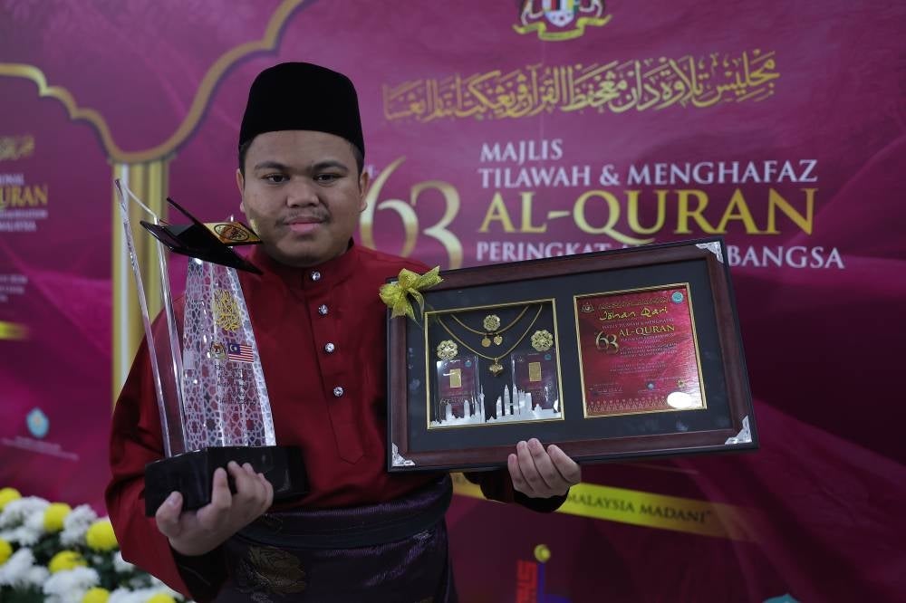 Muhammad Qayyim Nizar Sarimi won the men’s recitation category at the 63rd Malaysian International al-Quran Recitation and Memorisation Assembly (MTHQA 63) last night. Muhammad Qayyim, visually impaired since birth, won with a score of 94.96 per cent. - Photo by Bernama