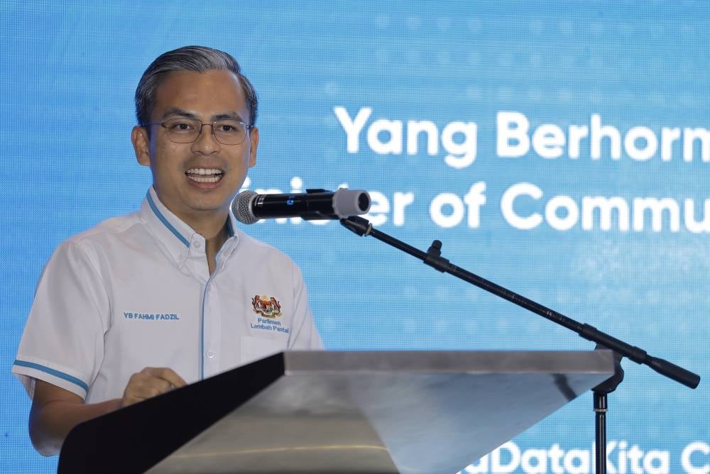 Communications and Digital Minister Fahmi Fadzil giving a speech before launching the #JagaDataKita campaign and Touch 'n Go eWallet MyCyberShield personal data protection subscription in Bangsar South. - BERNAMA PIX