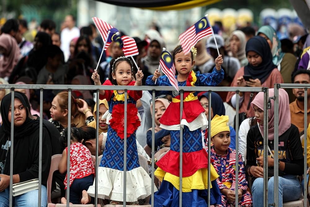 Children dressed in Jalur Gemilang-themed outfits were highly motivated to join the thousands of visitors who thronged Dataran Putrajaya today for the 2023 National Day celebration. - BERNAMA 