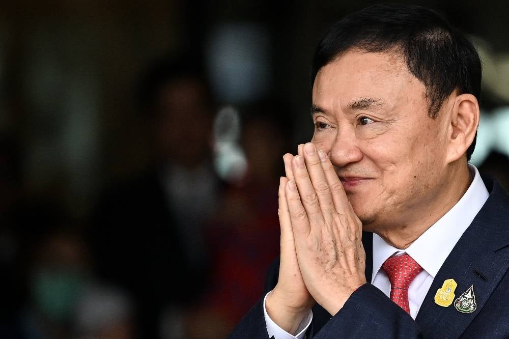 Thailand’s jailed former prime minister Thaksin Shinawatra has requested a royal pardon from the eight-year jail term he is serving, outgoing justice minister Wissanu Krea-ngam said. - (Photo by MANAN VATSYAYANA / AFP)