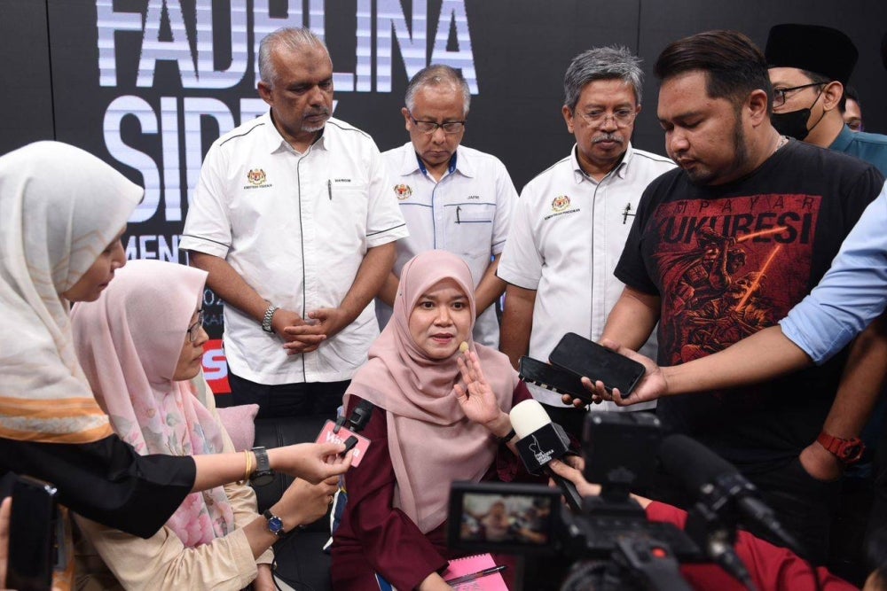 Fadhlina (seated, centre) speaking with reporters after the Town Hall session. - Photo by Sinar Harian / Mohd Rafiq Redzuan Hamzah