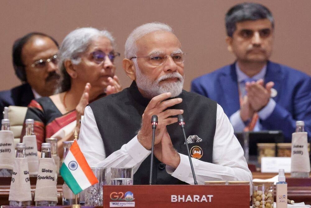 India's Prime Minister Narendra Modi (centre) gestures during the first session of the G20 Leaders' Summit at the Bharat Mandapam in New Delhi on Sept 9. (Photo by Ludovic MARIN / POOL / AFP)