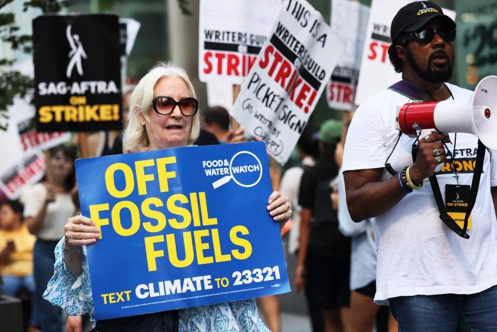 WGA and SAG-AFTRA climate storytellers, writers, actors, production workers, and activists participated in a Climate and Labor Justice picket ahead of the upcoming March to End Fossil Fuels, for a more sustainable industry career path and planet. (Photo by Michael M. Santiago / AFP)