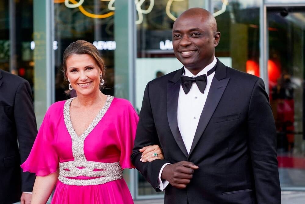 This picture taken on June 16, 2022 shows Norway's Princess Martha Louise (L) and her American fiancé Durek Verrett after the government's festive event in connection with Princess Ingrid Alexandra's official day, which was held at Deichman Bjorvika, Oslo's main library. (Photo by Lise Åserud / NTB / AFP) / Norway OUT