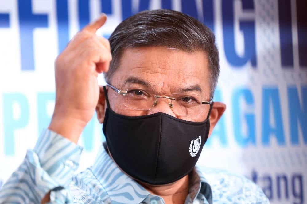 Home Minister Datuk Seri Saifuddin Nasution Ismail speaking to reporters after attending the 2023 Anti-Human Trafficking Day celebration in Putrajaya. - BERNAMA PIX