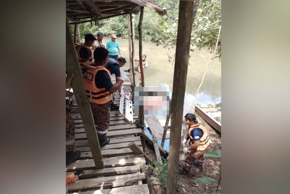Firemen carrying the boy's body after he drowned while swimming in the river.