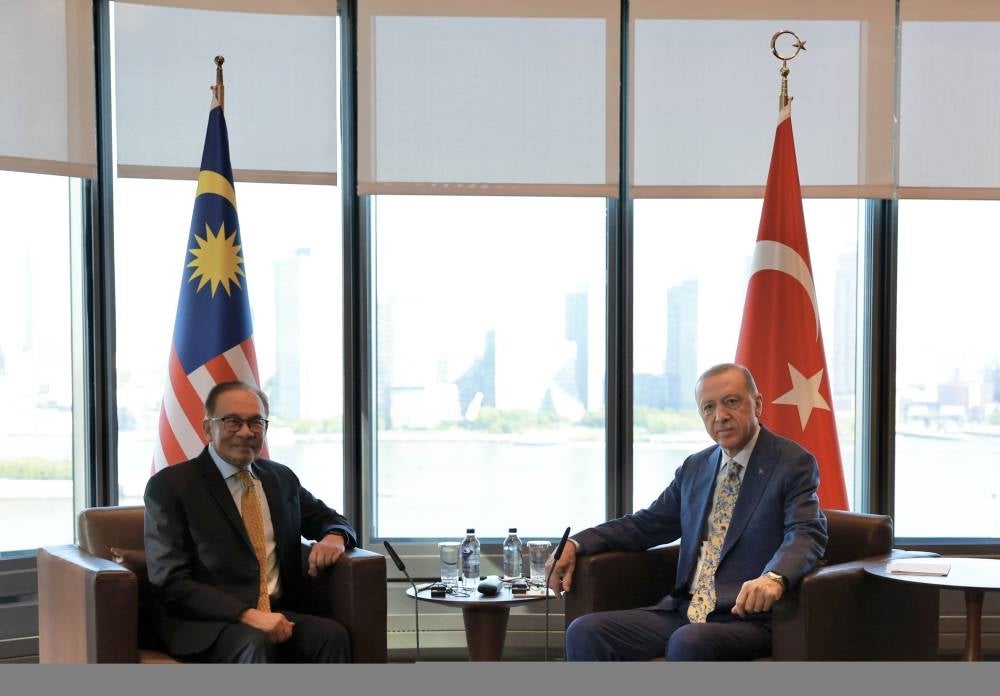 Anwar (left) during a meeting with Erdogan. Photo by Bernama