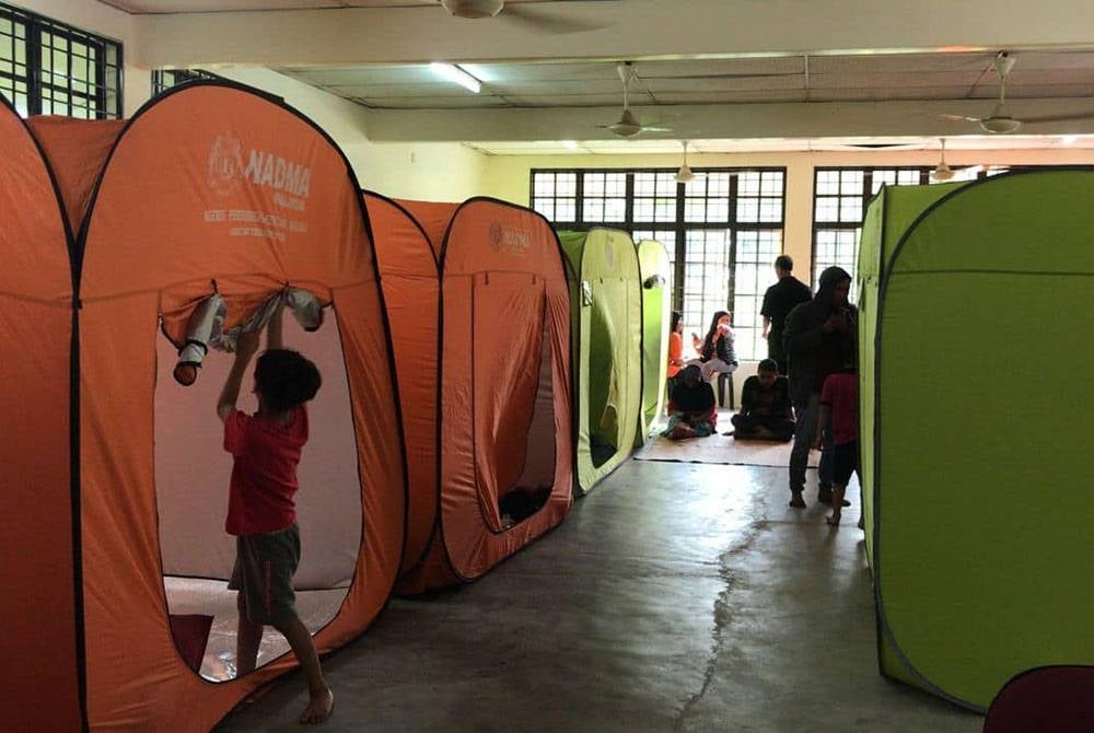 Evacuation centers opened at Kampung Simpang Halt near Taiping following flash floods. - Pix by Taiping Malaysian Civil Defence Force (APM)