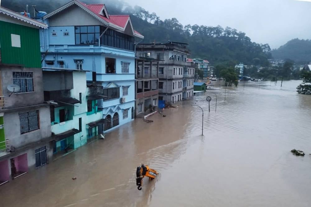 A flooded street in Lachen Valley, in India's Sikkim state following a flash flood caused by intense rainfall. Photo by INDIAN ARMY/AFP