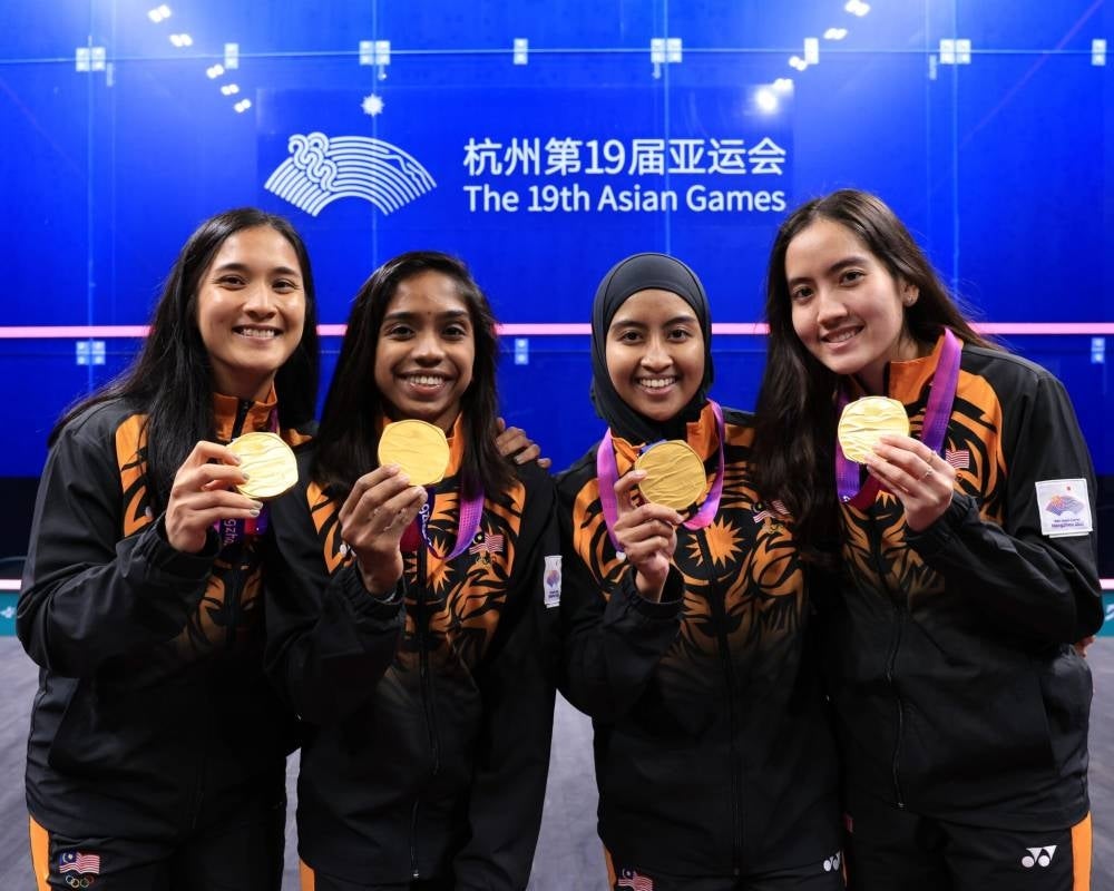 The women squash team with their gold medals - FILE PIX 