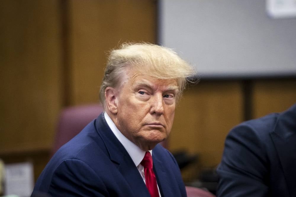 Former US president Donald Trump arrived for a historic court appearance in New York on Tuesday, facing criminal charges that threaten to upend the 2024 White House race - AFP 