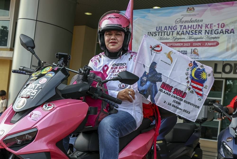 In June 2021 Sarlinawati Abdul Mues was diagnosed with fourth-stage breast cancer but far from being disheartened the 47-year-old cancer fighter is currently on a solo scooter tour across Peninsular Malaysia. - BERNAMA 