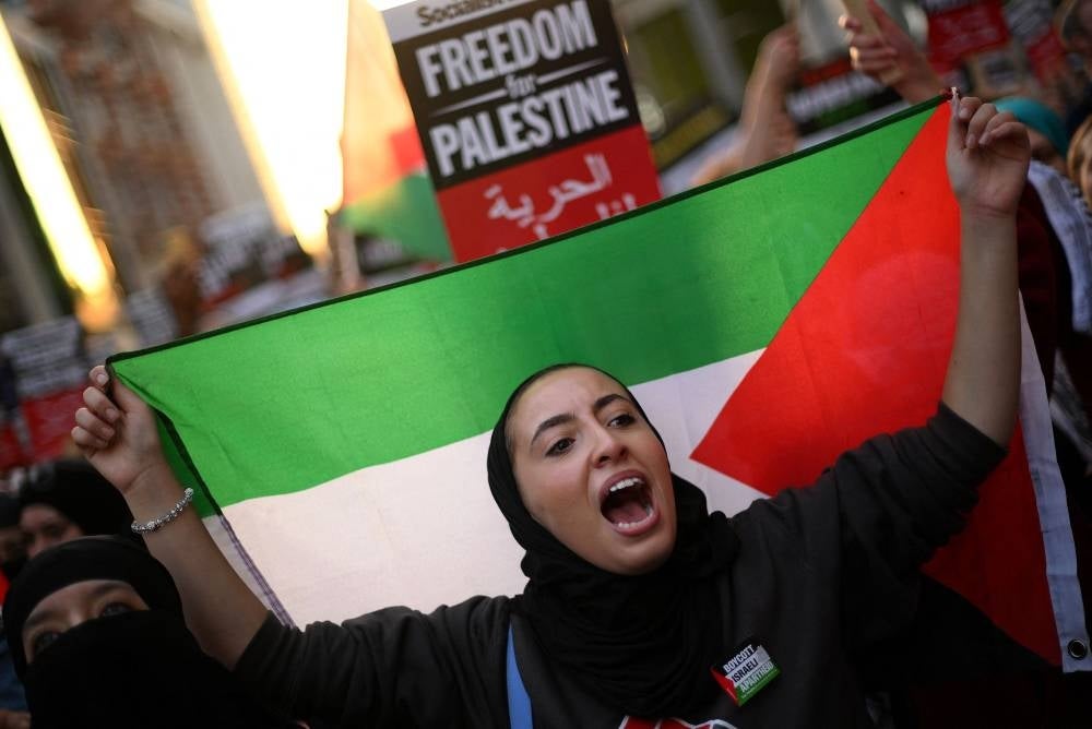 People take part in a 'Stand with Palestine' demonstration, close to the Embassy of Israel, in west London on October 9, 2023. Photo by Daniel Leal/ AFP
