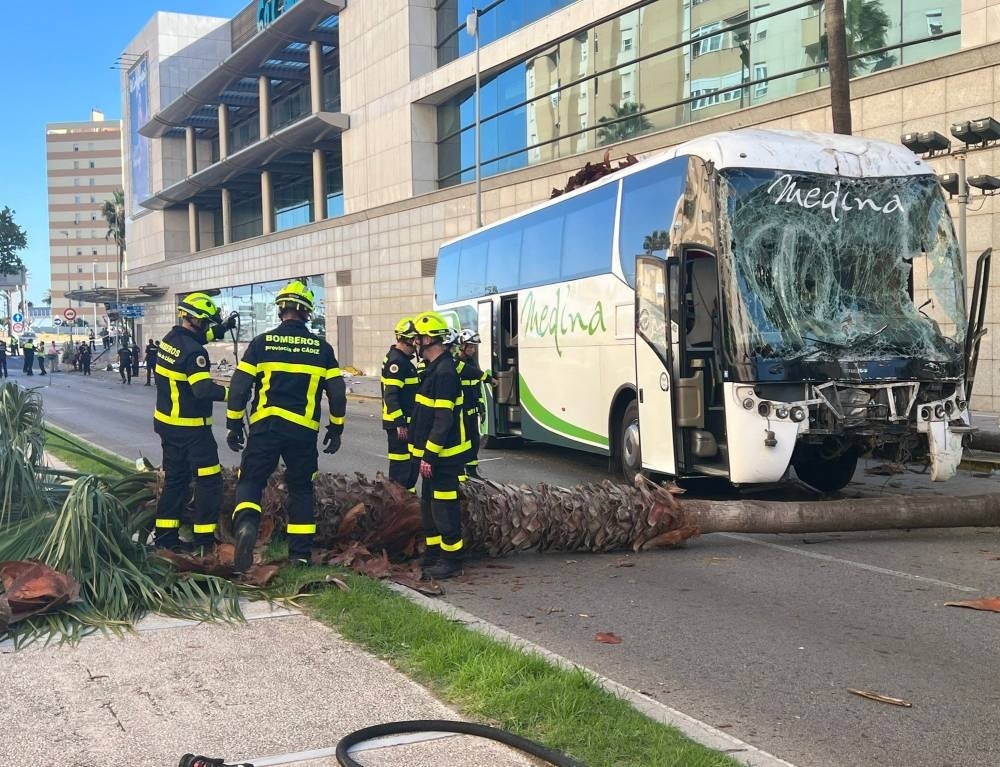 Firefighters next to a bus damaged after an accident that killed three women and injured a fourth, in Cadiz, southern Spain. Photo by @Cadiz Firefighters/X/ AFP) 