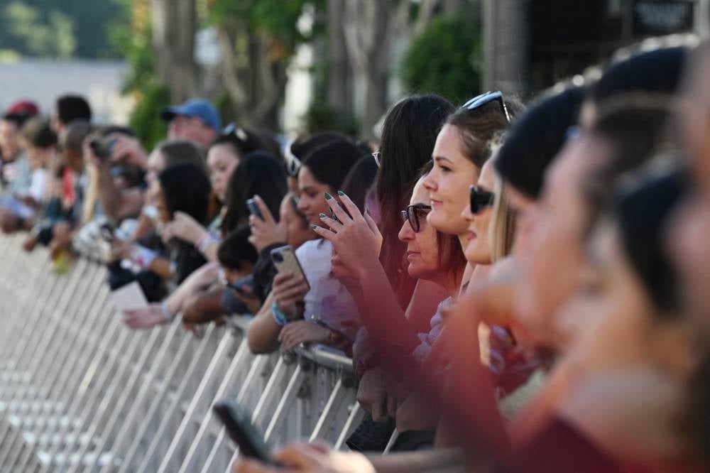 Fans gather outside the "Taylor Swift: The Eras Tour" concert movie world premiere at AMC The Grove in Los Angeles, California on Oct 11, 2023. - (Photo by Robyn Beck / AFP)