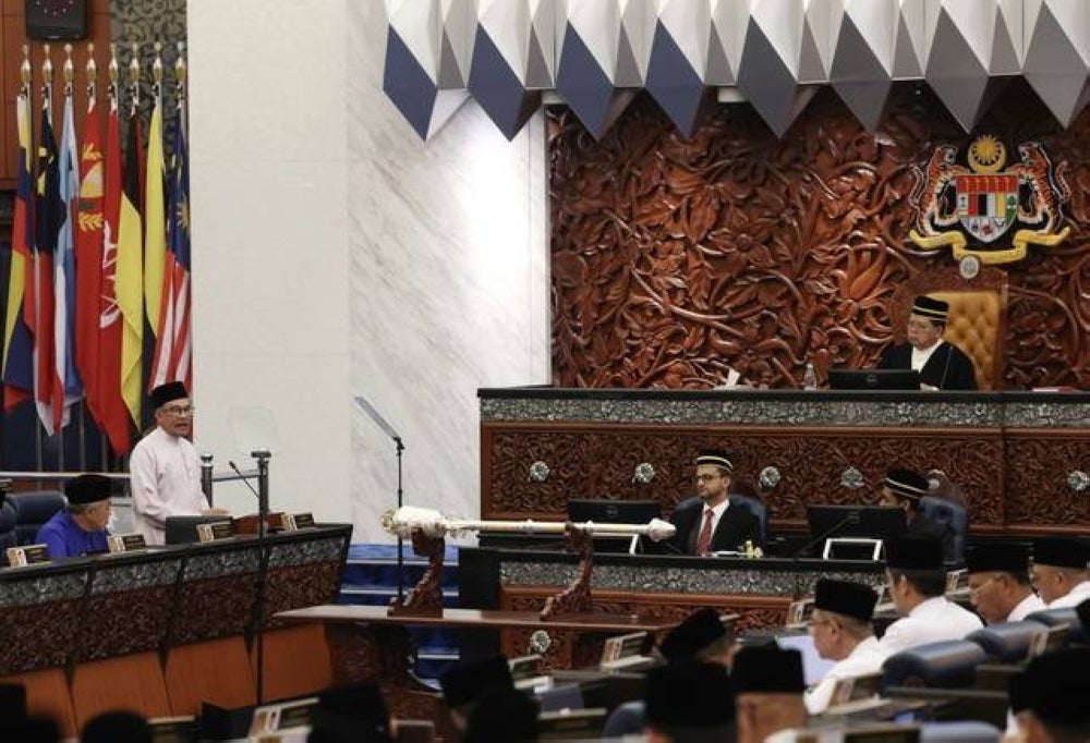 Finance Minister Datuk Seri Anwar Ibrahim tabling the Malaysia Madani Budget 2024 in Parliament, today. - Photo by Bernama