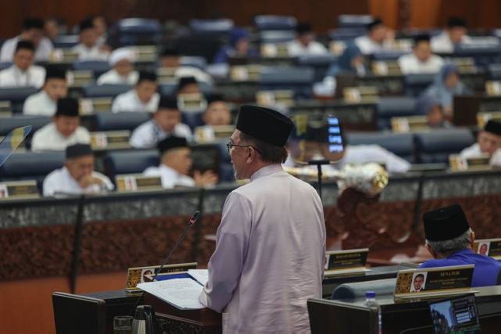 Finance Minister Datuk Seri Anwar Ibrahim tabling Budget 2024 in Dewan Rakyat today. - Photo by Bernama