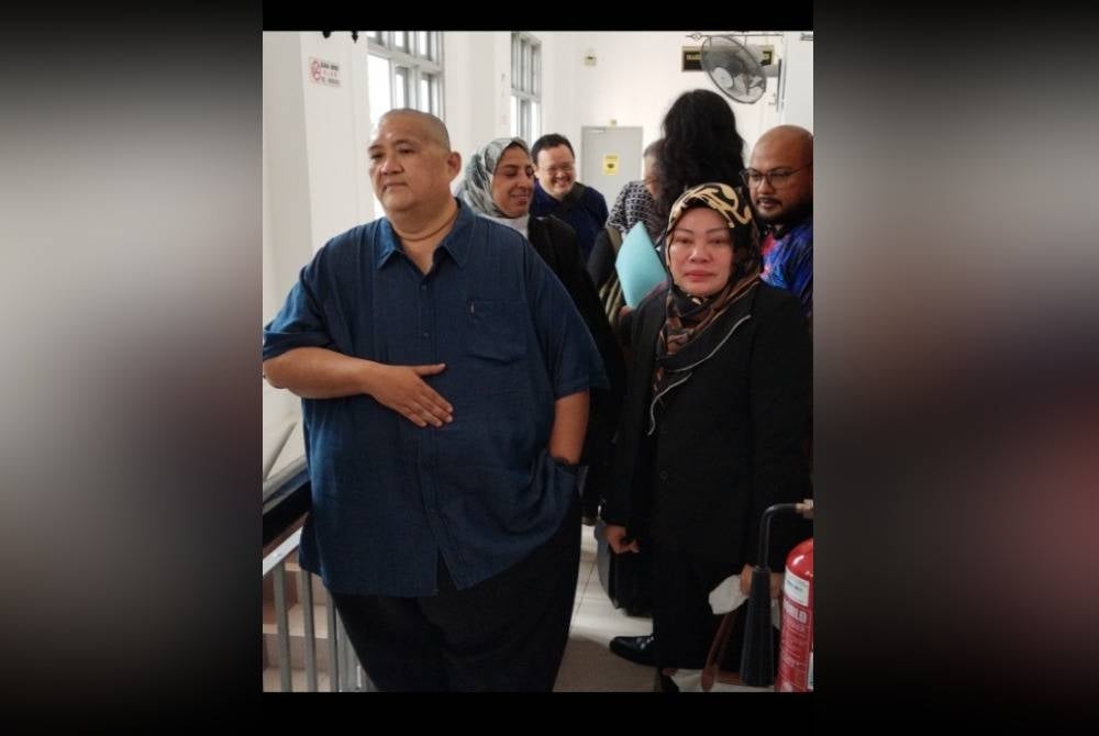 They are senior Immigration officer Haris Fadzilah Abu Bakar (left), 51, and Immigration assistant director Noryati Abu Bakar, 53.