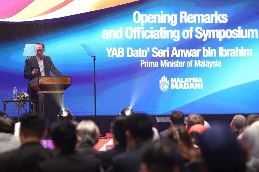 Prime Minister Datuk Seri Anwar Ibrahim delivering a keynote address at the opening of the Symposium - The Path Towards Greater Prosperity for Malaysia at Putrajaya International Convention Centre (PICC) today. - Photo by Bernama