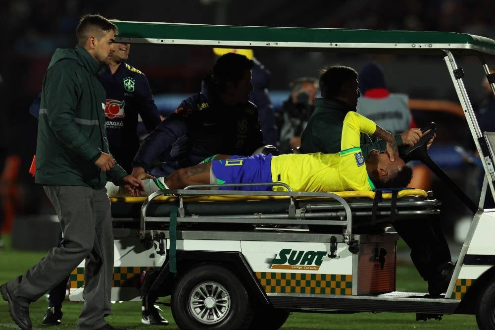 Brazil's forward Neymar leaves the field after an injury during the 2026 FIFA World Cup South American qualification football match between Uruguay and Brazil - AFP 