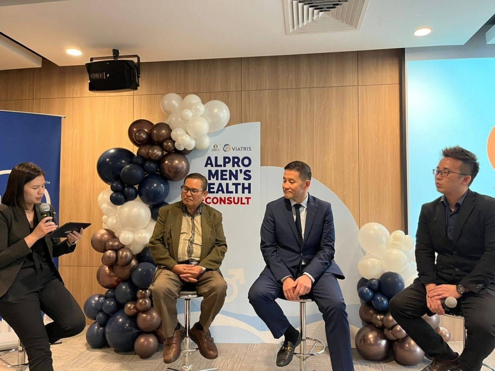 Guards Health Consultant Urologist Dr George Lee Eng Geap and Universiti Kebangsaan Malaysia Senior Consultant Psychiatrist Dr Hatta Sidi at the Alpro Pharmacy in collaboration with Viatris men's health teleconsult forum. - ADLIN SAHIMI 