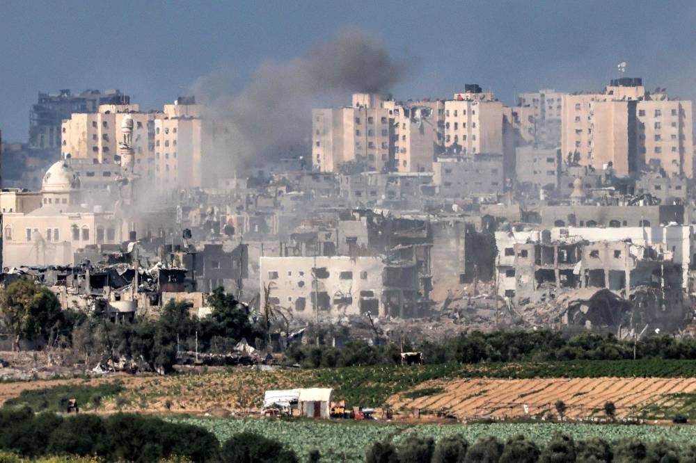 This picture taken from Israel's southern city of Sderot shows smoke billowing over the northern Gaza Strip during Israeli bombardment on October 19, 2023, amid ongoing battles between Israel and the Palestinian group Hamas. - Photo by AFP