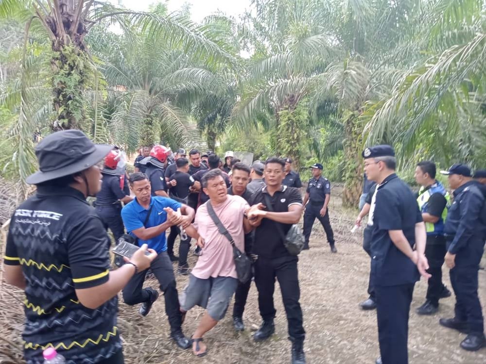 Enforcement officers and activists believed to be involved in a scuffle at the Silver Valley Technology Park project site 