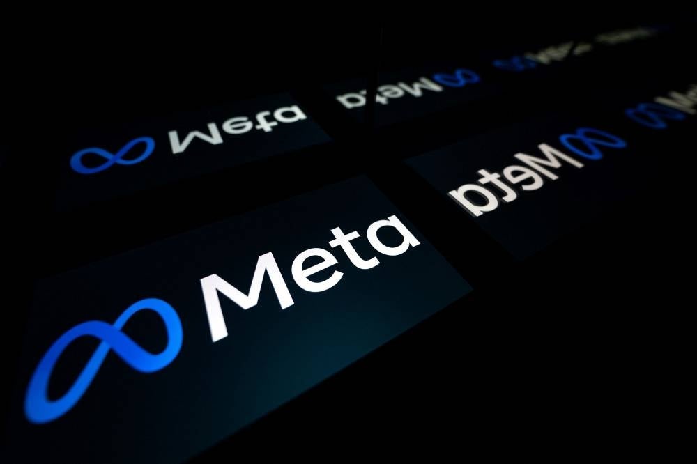 This picture taken on Jan 12, 2023 in Toulouse, southwestern France shows a tablet displaying the logo of the company Meta. - (Photo by LIONEL BONAVENTURE / AFP)