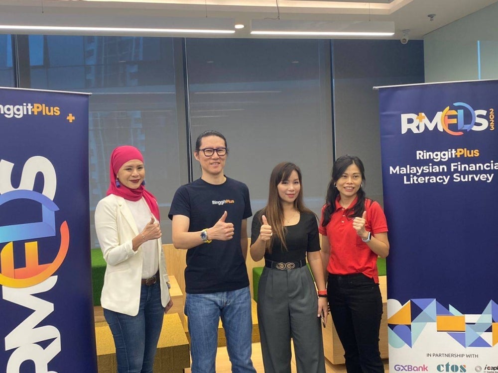 RinggitPlus CEO Yuen Tuck Siew (two, left) at the Malaysian Financial Literacy Survey 2023 event at the Etiqa Tower in Bangsar, today. - Photo by NURUL ATIKAH SARJI