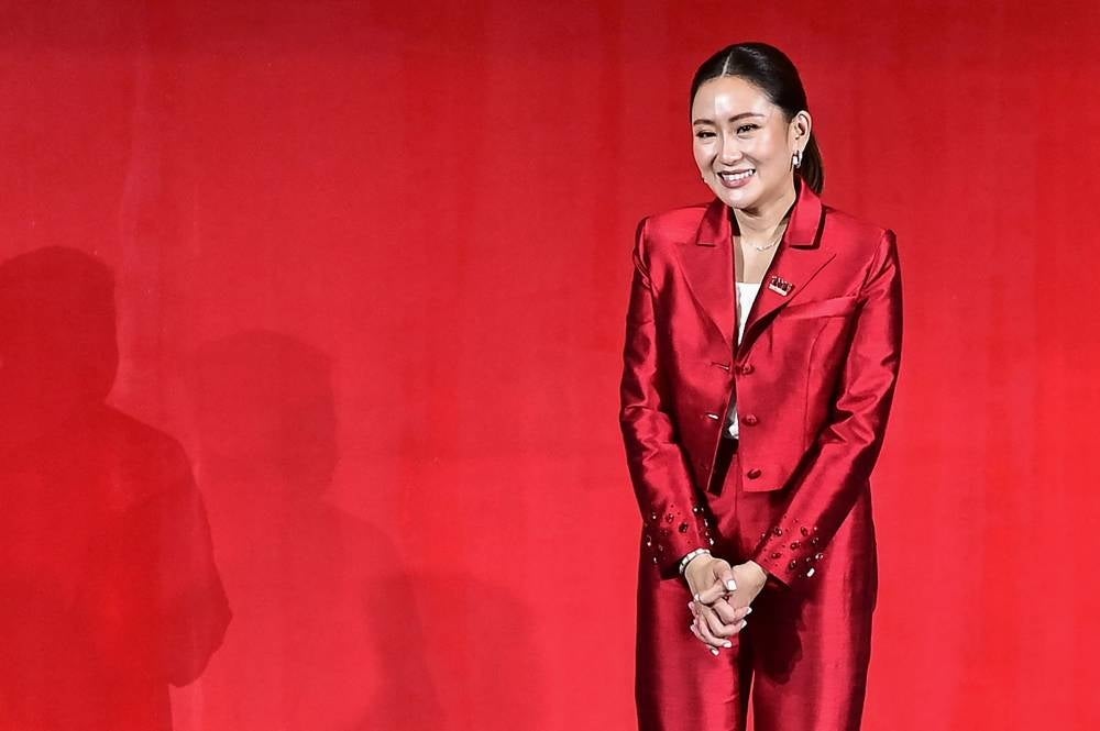 Newly-elected Pheu Thai Party leader Paetongtarn Shinawatra, youngest daughter of former Thai prime minister Thaksin Shinawatra, poses for photos - AFP 