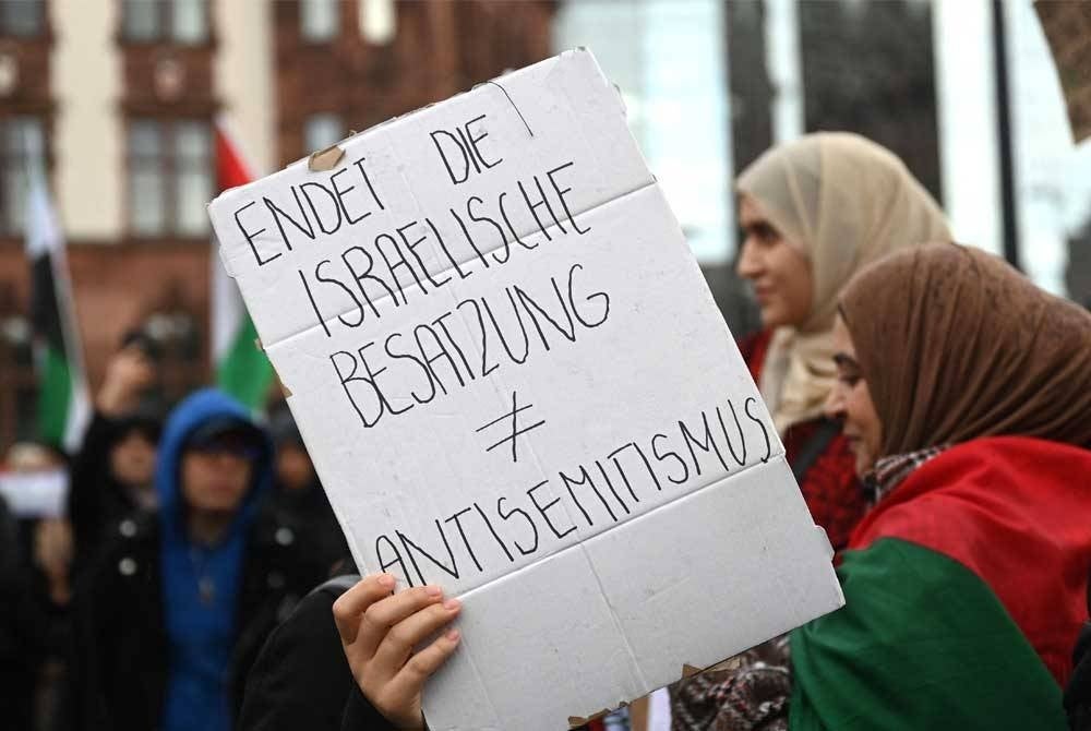 A demonstration in Dortmund, Germany on Saturday pushing for Israel to hold the ceasefire in Palestine. - AFP