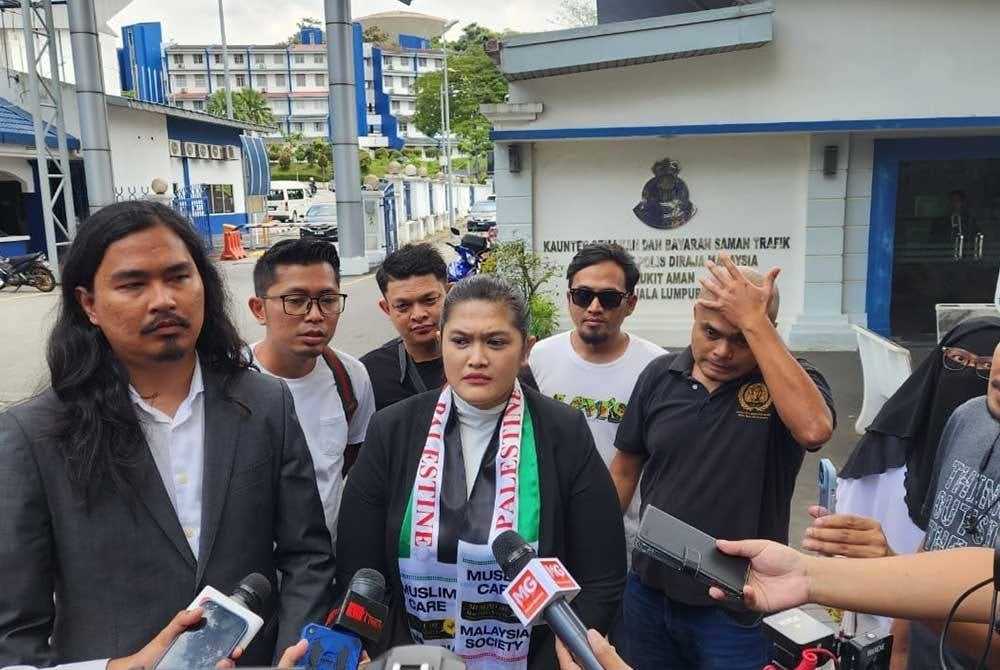 Syarul Ema Rena, known as the Ratu Naga, spoke to reporters after having her statement taken by the police. - FILE PIX