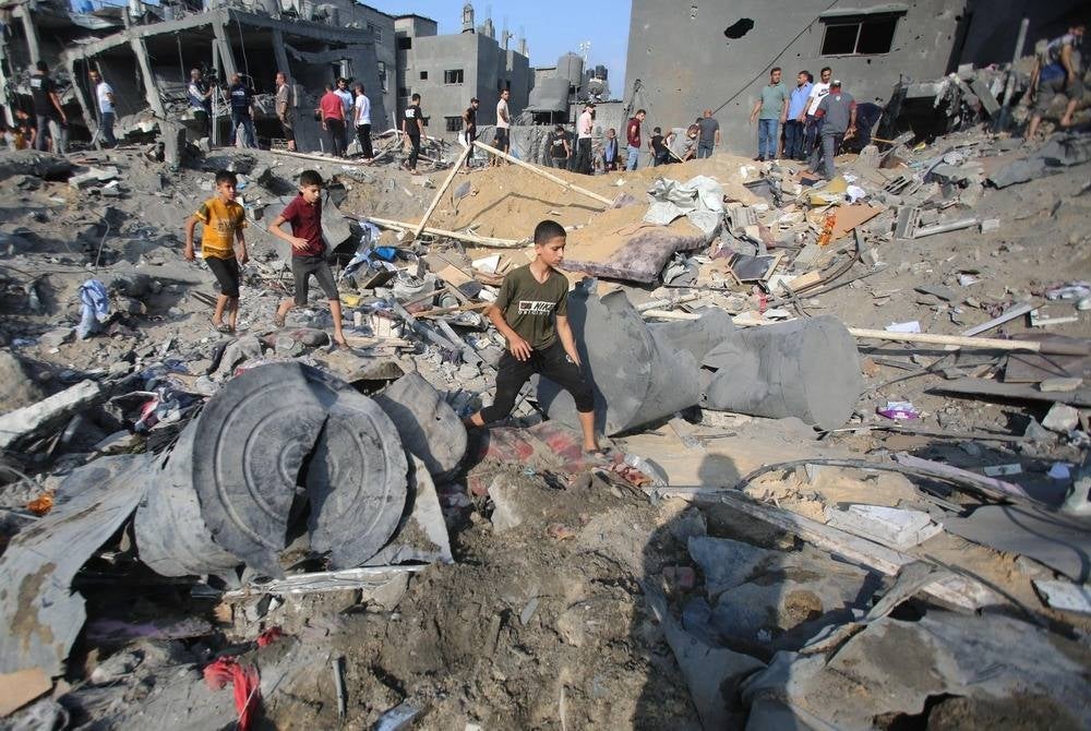 Palestinians check the destruction n the aftermath of an Israeli strike the previous night in the Jabalia camp for Palestinian refugees in the Gaza Strip, on Nov 1. (Photo by Bashar TALEB / AFP)