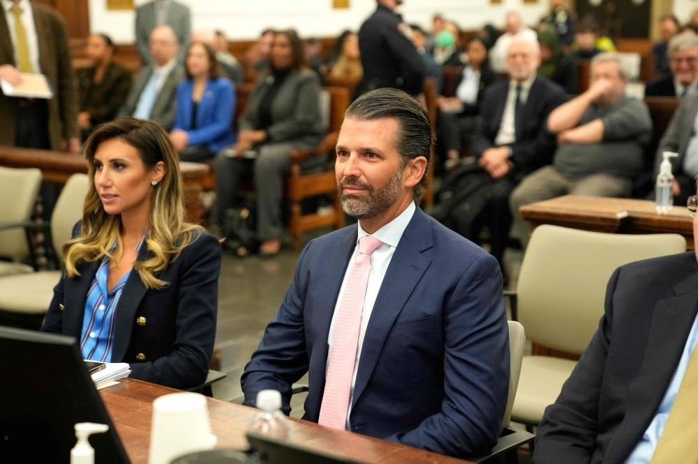 Donald Trump Jr. and lawyer Alina Habba are seated for the fraud trial of the Trump Organisation in New York City on November 1, 2023. Donald Trump Jr., is taking the stand one day before his brother, Eric Trump, testifies. Photo by Seth Wenig// AFP