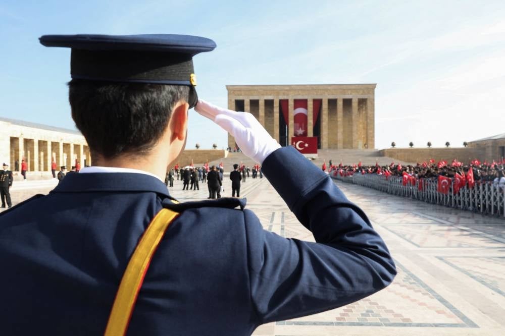 A soldier salutes in front of the mausoleum of Mustafa Kemal Ataturk, the founder of the Republic of Turkey, during the 100th Anniversary of the Republic of Turkey in Ankara on October 29, 2023. - Photo by AFP