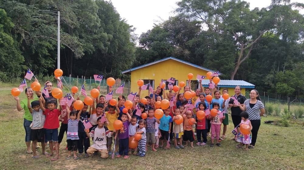 Allie Latin and her students at Tadika Cahaya Komuniti (PPKK) - FILE PIX