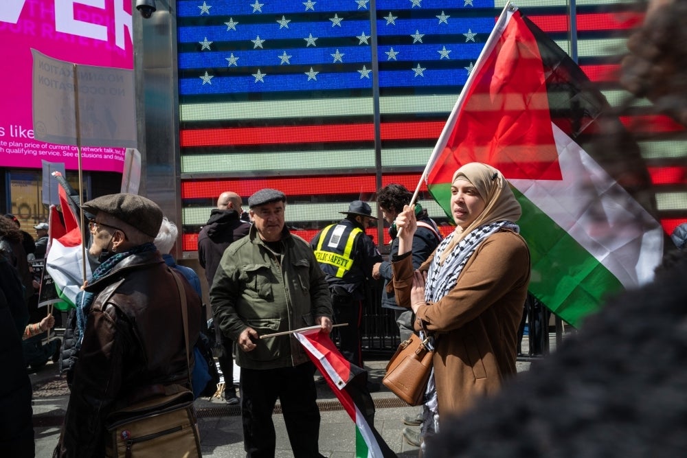 Palestinian supporters protested in Time Square, USA, against the Israeli army's crackdown on Jerusalem. - Photo by AFP