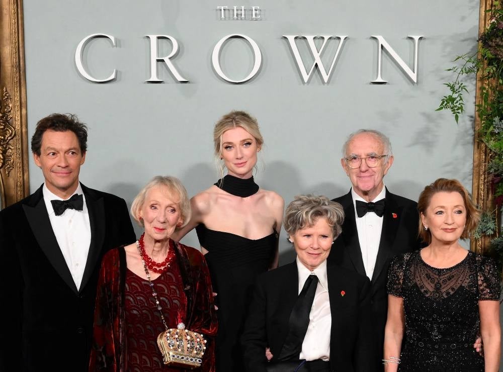 English actor Dominic West (from L), English actor Marcia Warren, Australian actor Elizabeth Debicki, English actor Imelda Staunton, Welsh actor Jonathan Pryce and English actor Lesley Manville pose on the red carpet upon arrival to attend the World Premiere of "The Crown (Season 5)" in London on Nov 8, 2022. (Photo by Daniel LEAL / AFP)