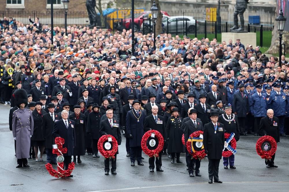 Veterans carry wreaths during the National Service of Remembrance at the Cenotaph on Whitehall in central London, on November 12, 2023. Remembrance Sunday is an annual commemoration held on the closest Sunday to Armistice Day, November 11, the anniversary of the end of the First World War and services across Commonwealth countries remember servicemen and women who have fallen in the line of duty since WWI. (Photo by Chris Jackson / POOL / AFP)