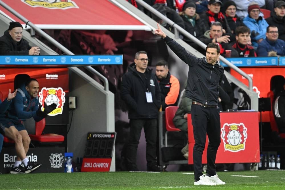 Bayer Leverkusen's Spanish coach Xabi Alonso gestures during the German first division Bundesliga football match Bayer 04 Leverkusen v 1 FC Union Berlin in Leverkusen, western Germany on Nov 12, 2023. (Photo by INA FASSBENDER / AFP) 