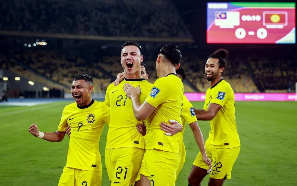 Harimau Malaya player Dion Johan Chai Cools (two, left) celebrates his goal in the World Cup 2026 and Asia Cup 2027 Qualification Group D match between Malaysia and Kyrgyzstan at the National Stadium Bukit Jalil tonight. (BERNAMA PHOTO)