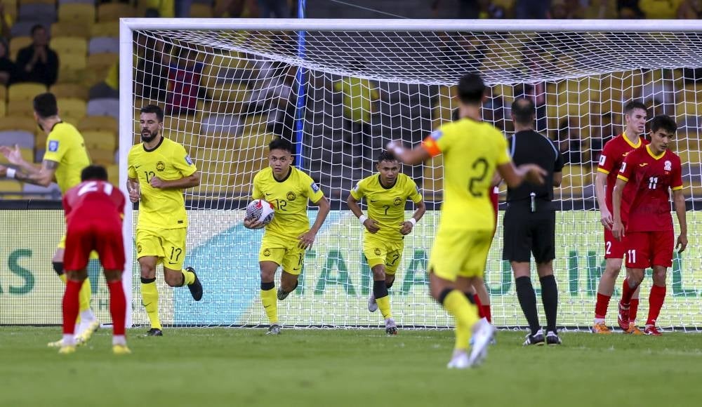 Malaysian player Arif Aiman (three, left) controls the ball after successfully scoring a goal against Kyrgyzstan in the World Cup 2026 and Asia Cup 2027 Qualification Group D match between Malaysia and Kyrgyzstan at the National Stadium Bukit Jalil tonight. (BERNAMA PHOTO)