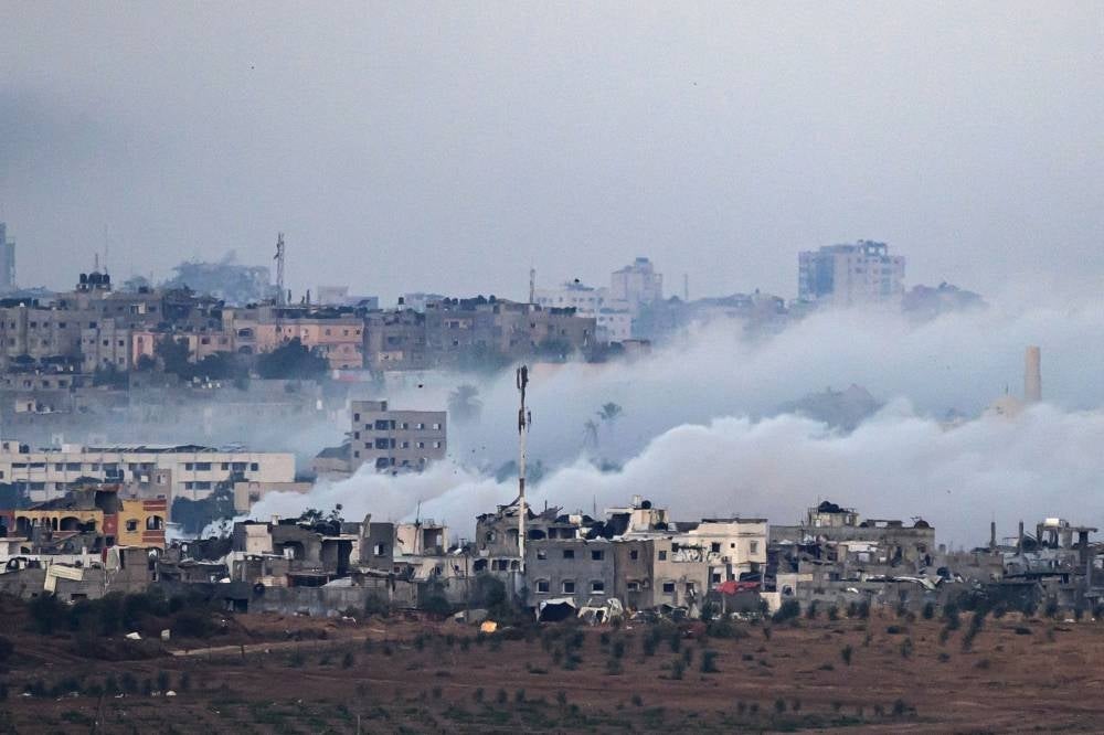 The Israeli army used smoke ammunition in the Palestinian territory on Nov 21, amid ongoing battles between Israel and the Palestinian Hamas movement. Photo by John Macdougal/AFP