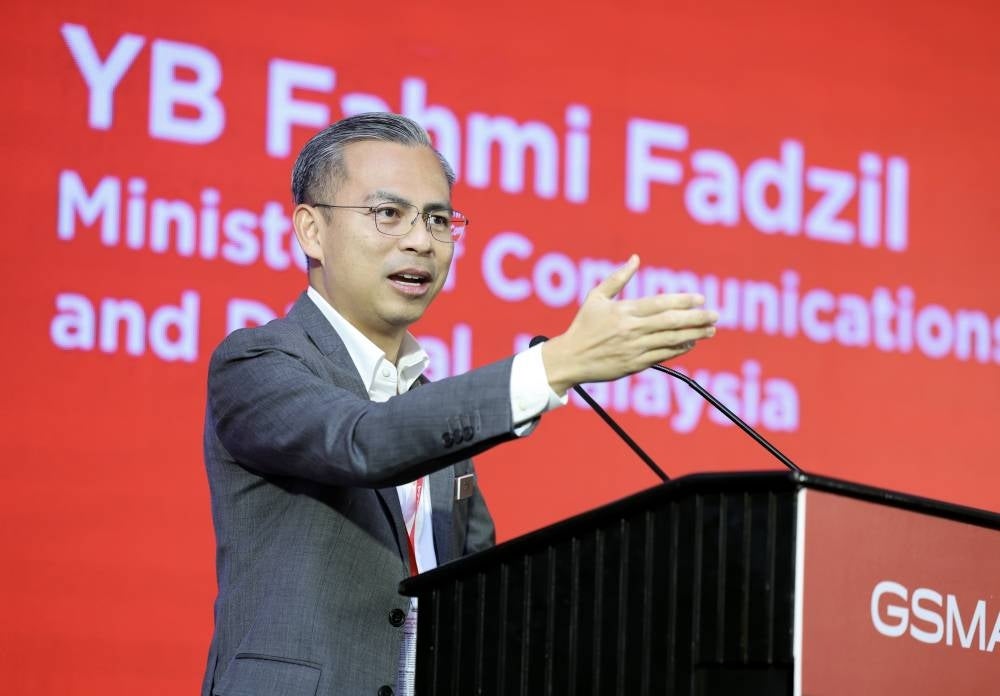 Communications and Digital Minister Fahmi Fadzil delivering his speech at the Digital Transformation Leader’s CxO Summit: Intelligent Digital Transformation in the 5G Era. - Photo by Bernama