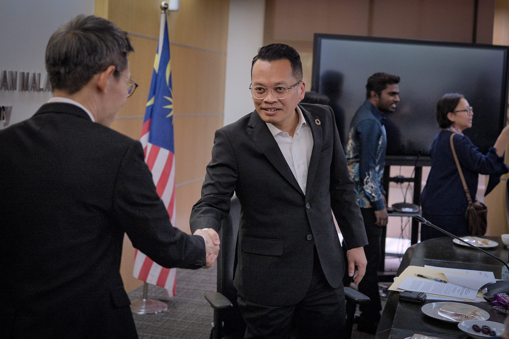 Nik Nazmi chairing the first Climate Change Consultative Meeting in September this year. (Nik Nazmi FB)