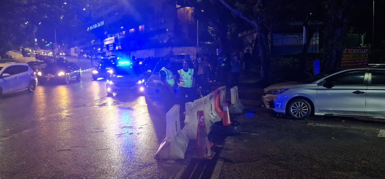 Police manning the entrance of the apartment.